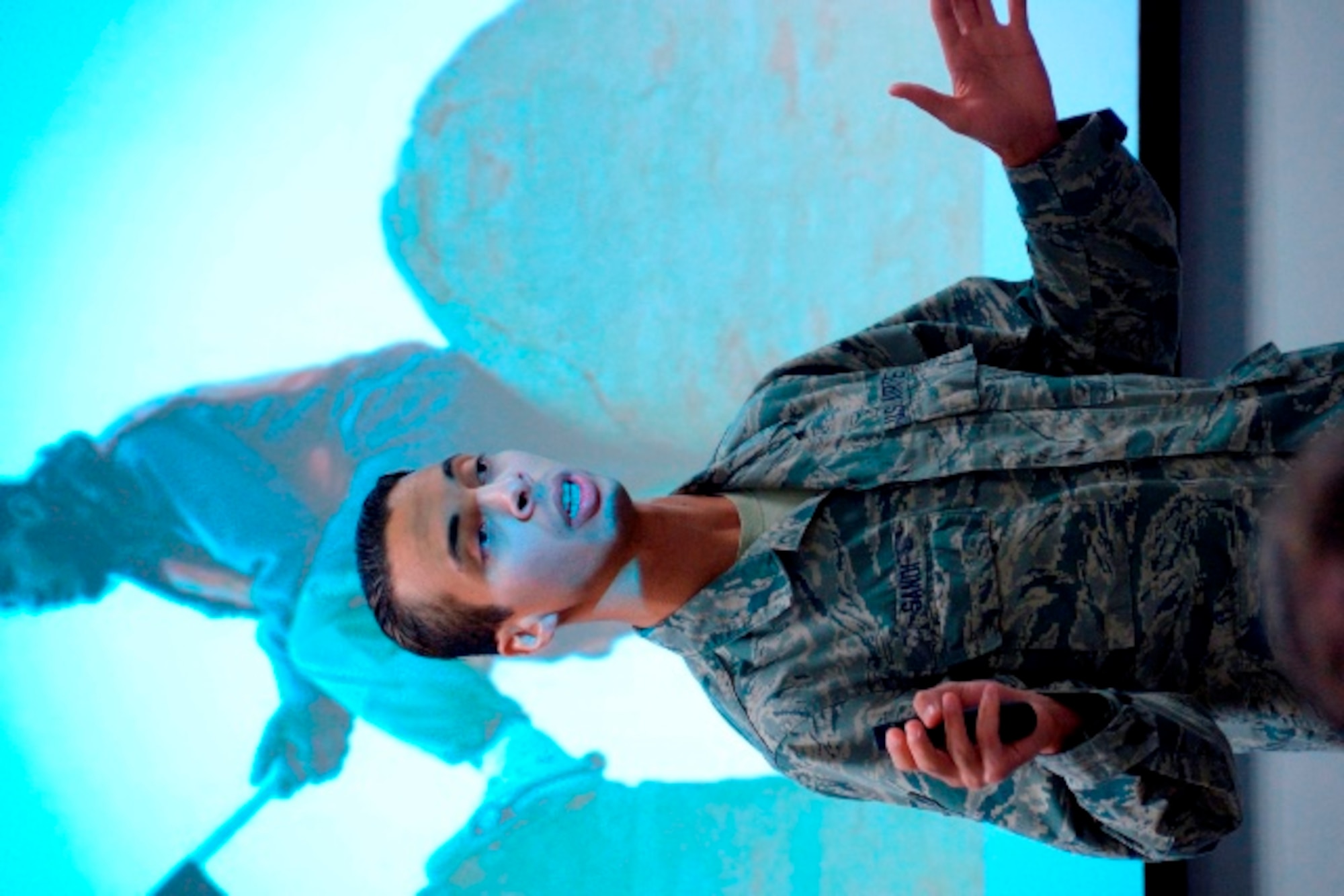 A U.S. Air Force Airman renders a salute to the American flag, depicting the proper respect to pay. According to Air Force Instruction 34-1201, Protocol, 8.1.6.2, when reveille or retreat is played, following “To the Color,” or the national anthem, military members are required to salute facing the flag or the direction of the music. Airmen are required to salute when the flag is raised, lowered or hoisted, including passing during special ceremonies. (U.S. Air Force illustration/Bob Stillwell) 