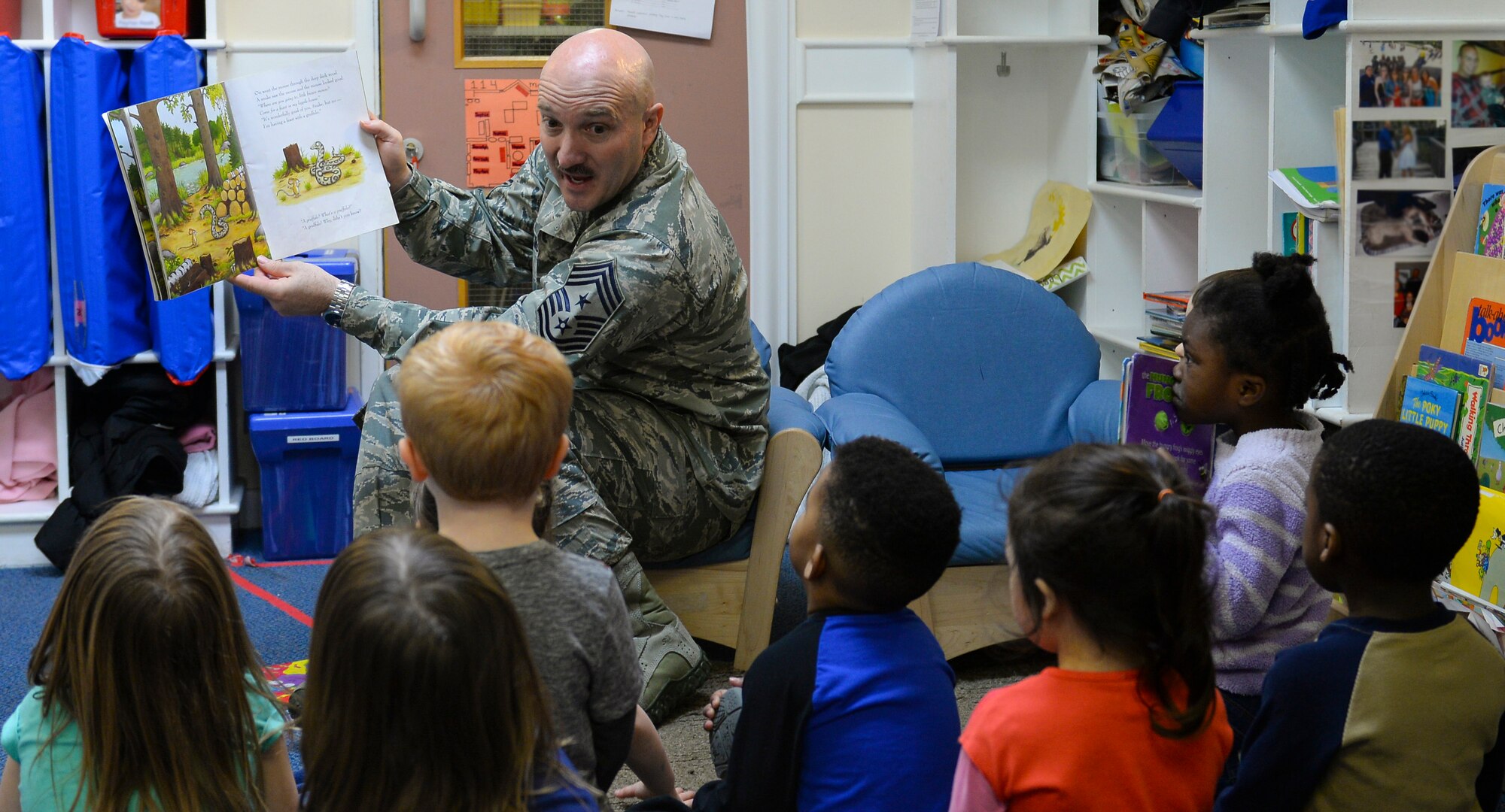 U.S. Air Force Chief Master Sgt. Anthony Cruz-Munoz, 100th Air Refueling Wing command chief, reads to children at the Child Development Center March 29, 2016, on RAF Mildenhall, England. Cruz-Munoz read to the children in celebration of Dr. Seuss’ birthday. The CDC is celebrating the famous writer by inviting members of Team Mildenhall to read to children. (U.S. Air Force photo by Staff Sgt. Micaiah Anthony/Released)