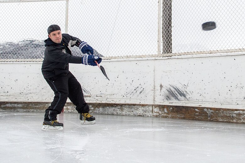 Army and Air force personnel play hockey at Buckner Fitness Center, Feb. 22, 2016. (U.S. Air Force photo by Senior Airman James Richardson)