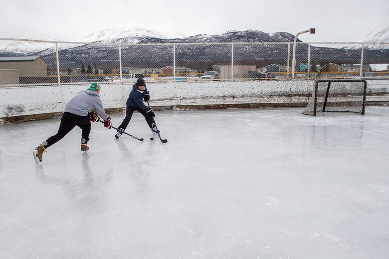 Army and Air force personnel play hockey at Buckner Fitness Center, Feb. 22, 2016. (U.S. Air Force photo by Senior Airman James Richardson)