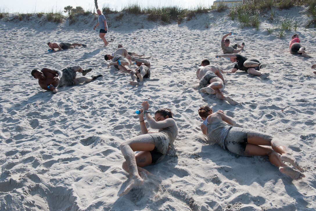 Members here participated in an Obstacle Mudd Race, March 30, 2016, at the Beach House at Patrick Air Force Base, Fla. The 45th Force Support Squadron Run Series included two-person teams, in which they ran, crawled, and climbed their way to the finish line. (U.S. Air Force photos/Benjamin Thacker) (Released) 