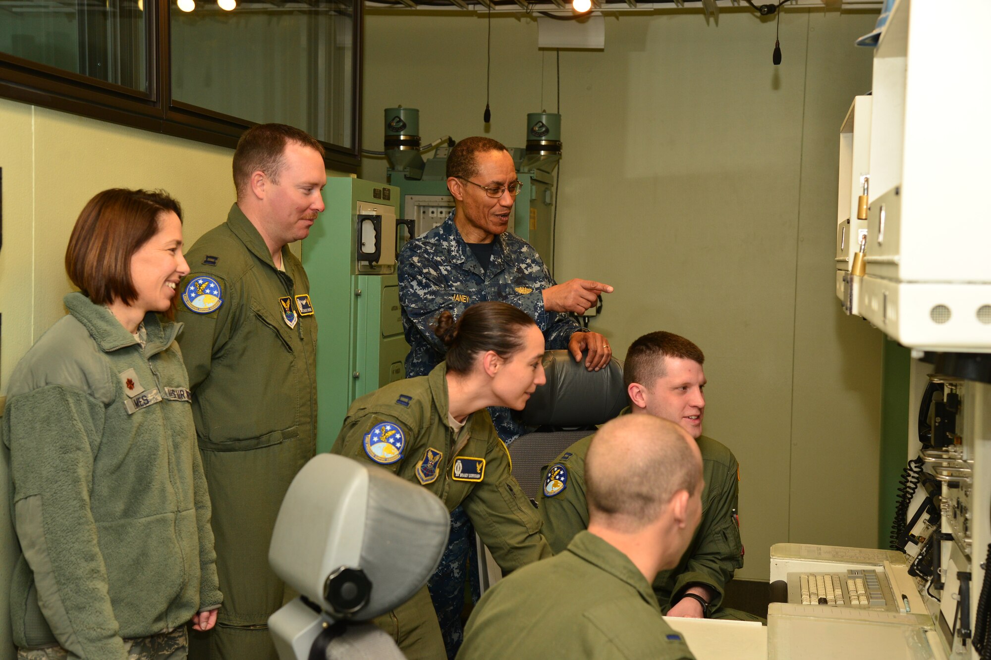 U.S. Navy Adm. Cecil D. Haney, U.S. Strategic Command (USSTRATCOM) commander (center), speaks to missileers assigned to the 341st Missile Wing during his visit to an intercontinental ballistic missile (ICBM) launch facility near Malmstrom Air Force Base, Mont., March 30, 2016. While there, Haney and Mr. David G. Brown (not pictured), Strategic Command Consultation (SCC) Committee member, presented the 2015 Omaha Trophy, ICBM category, to U.S. Air Force Col. John T. Wilcox II, 341st Missile Wing commander (not pictured) and Team Malmstrom, in recognition of the wing's contributions to USSTRATCOM's global strategic missions. The Omaha Trophy, which dates back to the U.S. Air Force's Strategic Air Command, was originally created by the SCC in 1971. At the time, a single trophy was presented annually as a token of appreciation to USSTRATCOM's best wing. Since then, the tradition has evolved to unit-level awards that recognize the command's premier ICBM wing, ballistic missile submarine, strategic bomber wing and global operations (space/cyberspace) unit. This year, a new category was added to include the combatant command's top strategic aircraft wing. (U.S. Air Force photo by Airman Daniel Brosam)