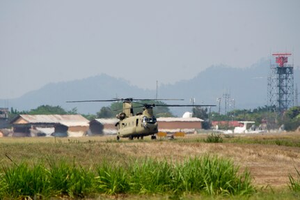 A U.S. Army CH-47 Chinook prepares to depart Soto Cano Air Base in support of firefighting efforts on the North coast of Honduras, Mar. 31, 2016, after Juan Orlando Hernandez, President of Honduras, sent a request for support to the U.S. Ambassador in Honduras. The aircraft was one of several which responded from Joint Task Force-Bravo, aiding the Honduran Fire Department, Army and Air Force already working to control the fire in the Jeanette Kawas National Park. (U.S. Air Force photo by Capt. Christopher Mesnard/Released)