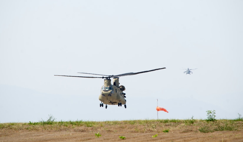 A U.S. Army CH-47 Chinook departs Soto Cano Air Base in support of firefighting efforts on the North coast of Honduras, Mar. 31, 2016, after Juan Orlando Hernandez, President of Honduras, sent a request for support to the U.S. Ambassador in Honduras. The members of Joint Task Force-Bravo regularly train with the countries of Central America to respond to firefighting scenarios, due to various hard to reach locations vulnerable to wildfires. (U.S. Air Force photo by Capt. Christopher Mesnard/Released)