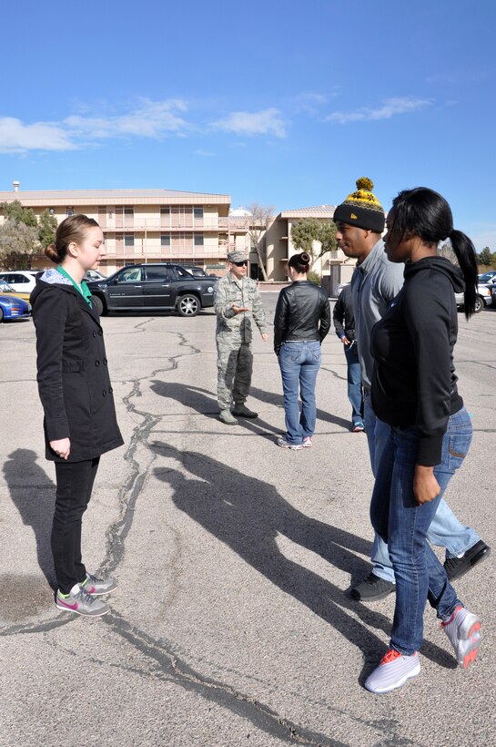 Members of the 926th Training and Development Flight practice facing movements at Nellis Air Force Base, Nev. A program instituted by Air Force Reserve Command, the training flight feeds into the Delayed Entry Program for future trainees waiting to leave for Basic Military Training. (U.S. Air Force photo/Maj. Jessica D'Ambrosio)