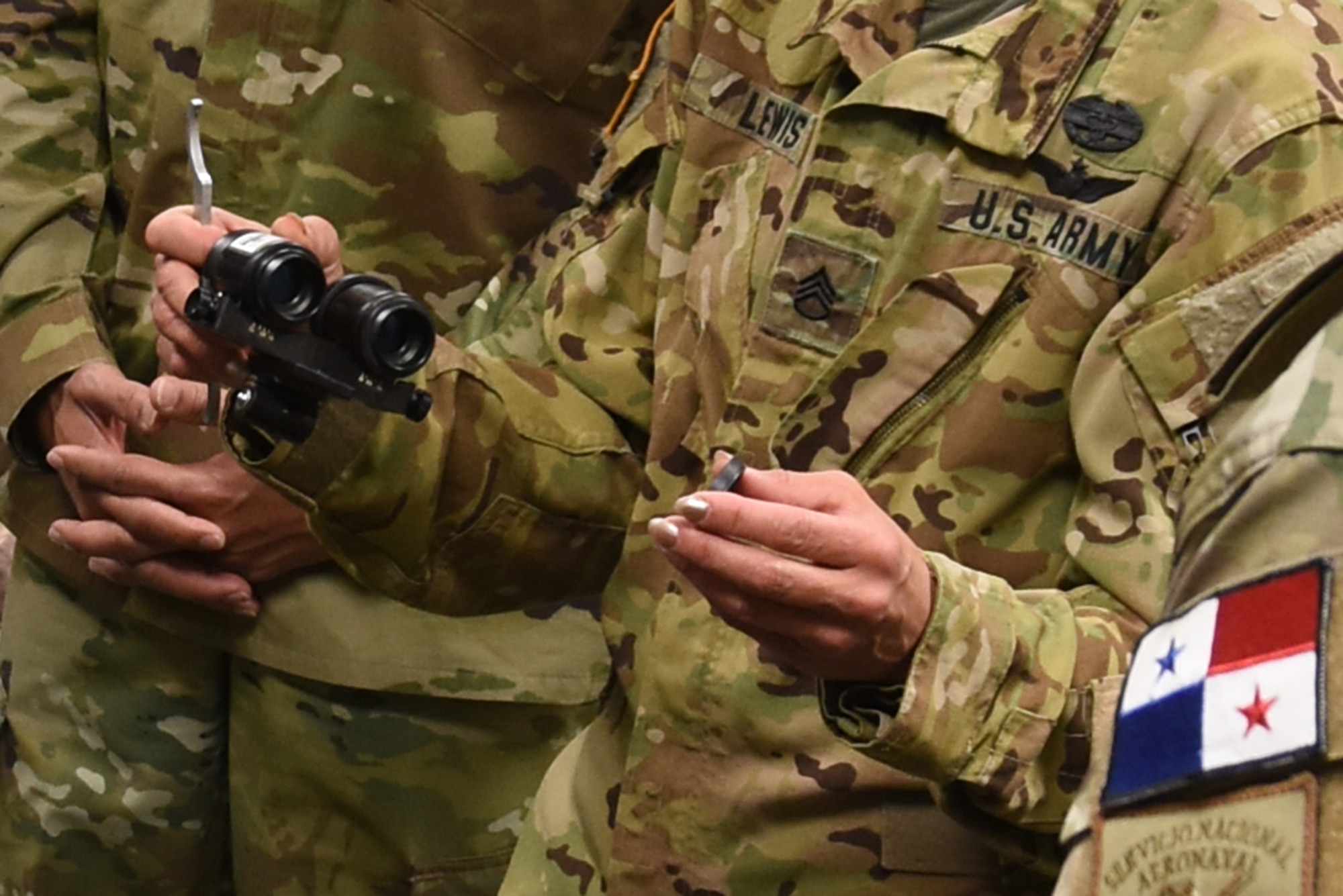 U.S. Army Staff Sgt. Michelle Lewis, an aviation life support equipment (ALSE) NCO technician assigned to the Missouri Army National Guard’s 1-135th Attack Reconnaissance Battalion, explains how to properly focus Night Vision Goggles (NVGs) when performing maintenance to members of the Panamanian Public Forces at Whiteman Air Force Base, Mo., March 16, 2016. During the visit, six representatives from the Public Forces participated in a subject matter exchange with the Missouri National Guard, covering topics including aviation life support and NVGs.
(U.S. Air National Guard photo by Senior Master Sgt. Mary-Dale Amison)
