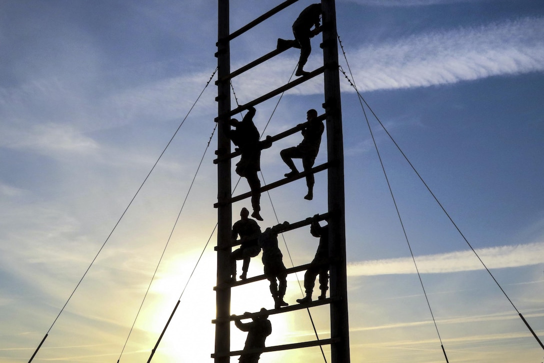 Paratroopers climb an obstacle during physical fitness training at Fort Bragg, N.C., March 24, 2016. The paratroopers are assigned to the 82nd Airborne Division’s 2nd Battalion, 505th Parachute Infantry Regiment, 3rd Brigade Combat Team. Army photo by Sgt. Anthony Hewitt