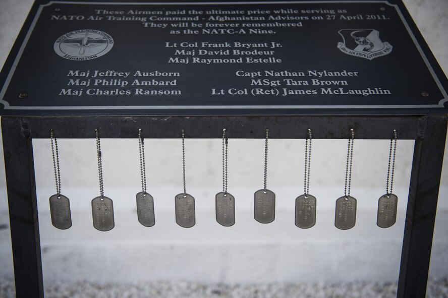 Dog tags of the nine Airmen killed sit on display during the remembrance ceremony on Forward Operating Base Oqab, Kabul, Afghanistan, April 27, 2016. The ceremony honored the nine Airmen who were shot and killed on the Afghan Air Force base on April 27, 2011, along with two Airmen assigned to the command, who lost their lives in a helicopter crash on October 11, 2015.(U.S. Air Force photo/Staff Sgt. Larry E. Reid Jr., Released) 