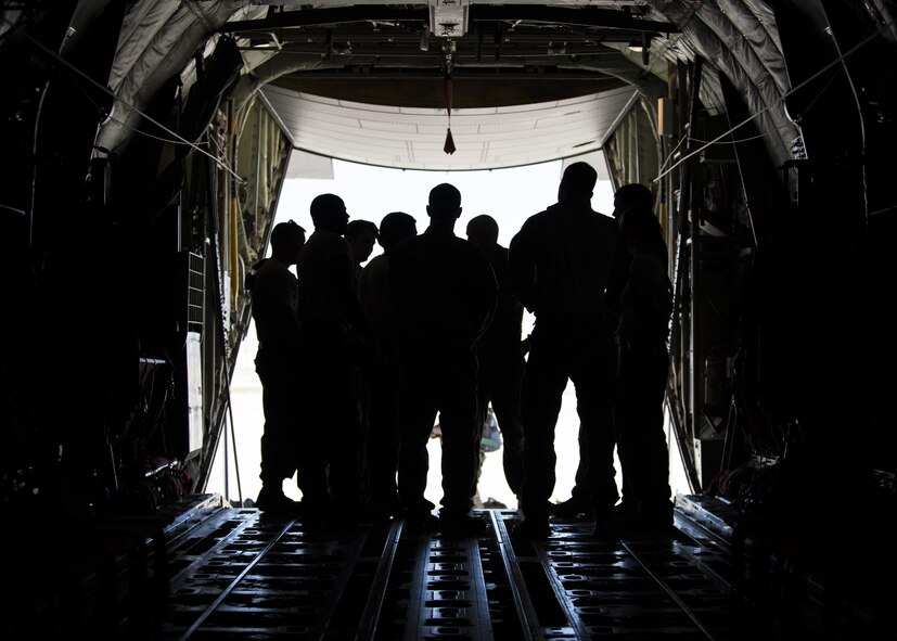 Members of the 774th Expeditionary Airlift Squadron and the 83rd Expeditionary Rescue Squadron conduct a pre-brief in the back of a C-130J Super Hercules before takeoff at Bagram Airfield, Afghanistan, April 28, 2016. Members of the 83rd Expeditionary Rescue Squadron are aided by the 774th EAS as they conduct a mission rehersal to stay up to date on their training and tactics in support of Operation Freedom's Sentinel and NATO's Resolute Support Mission. (U.S. Air Force photo by Senior Airman Justyn M. Freeman)