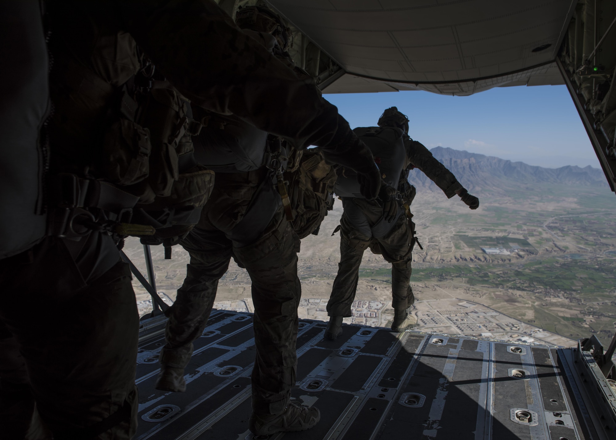 Pararescuemen from the 83rd Expeditionary Rescue Squadron jump from a C-130J during a mission rehersal at Bagram Airfield, Afghanistan, April 28, 2016. Members of the 83rd Expeditionary Rescue Squadron are aided by the 774th Expeditionary Rescue Squadron as they conduct a mission rehersal to stay up to date on their training and tactics in support of Operation Freedom's Sentinel and NATO's Resolute Support Mission. (U.S. Air Force photo by Senior Airman Justyn M. Freeman)