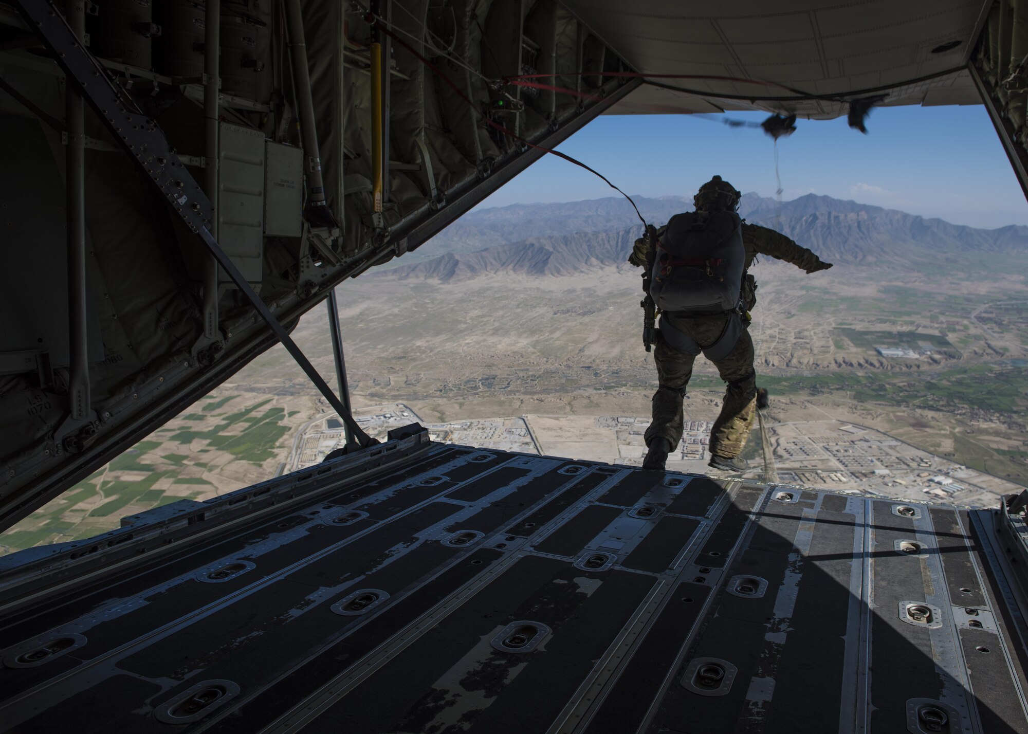 A pararescueman from the 83rd Expeditionary Rescue Squadron jumps from a C-130J Super Hercules during a mission rehersal at Bagram Airfield, Afghanistan, April 28, 2016. Members of the 83rd Expeditionary Rescue Squadron are aided by the 774th Expeditionary Rescue Squadron as they conduct a mission rehersal to stay up to date on their training and tactics in support of Operation Freedom's Sentinel and NATO's Resolute Support Mission. (U.S. Air Force photo by Senior Airman Justyn M. Freeman)