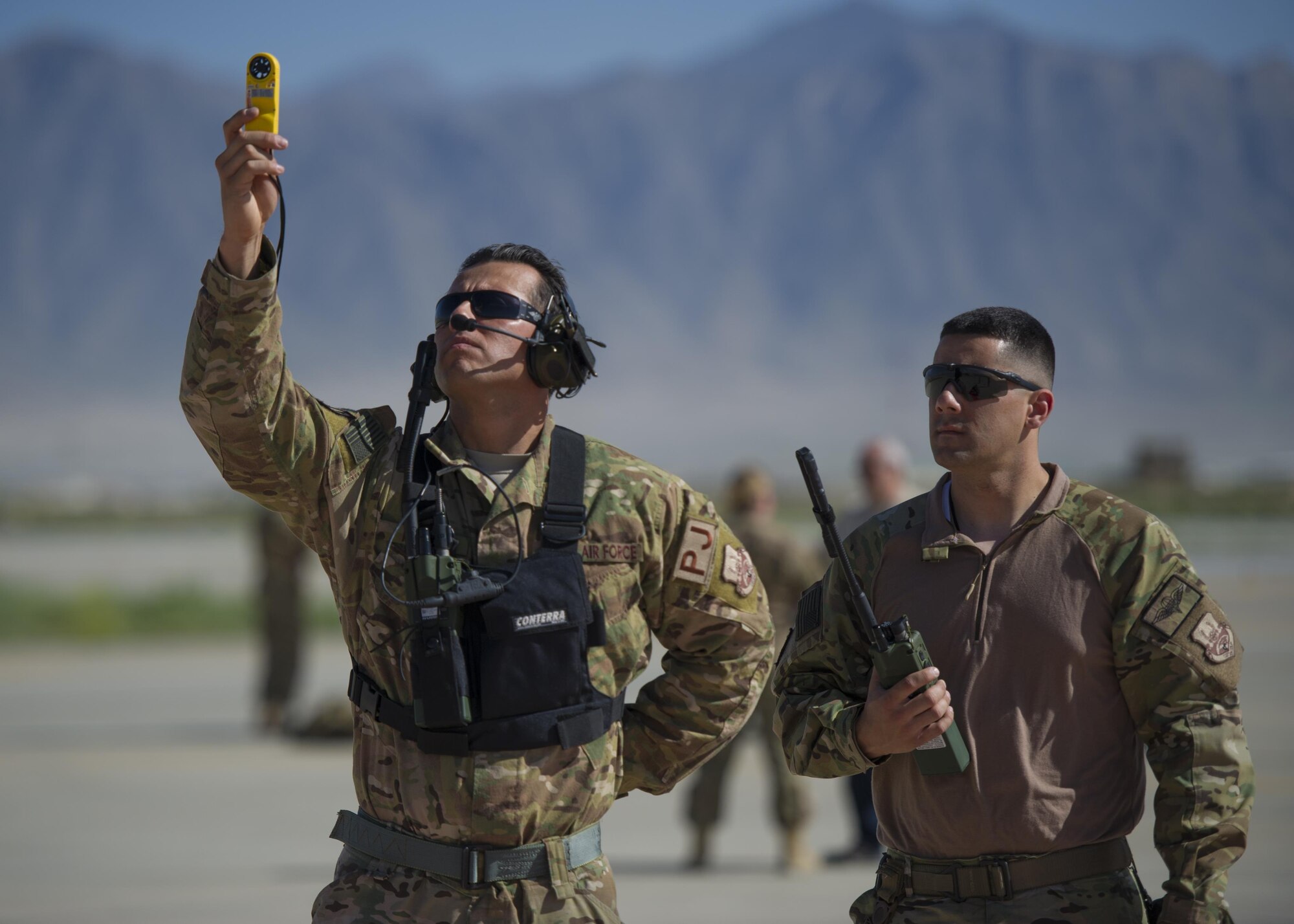 Pararescuemen from the 83rd Expeditionary Rescue Squadron test the wind as team members prepare to jump from a C-130J Super Hercules during a mission rehersal at Bagram Airfield, Afghanistan, April 28, 2016. Pararescue specialists rescue and recover downed aircrew from hostile or otherwise unreachable areas. (U.S. Air Force photo by Technical Sgt. Robert Cloys)
