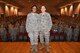 Col. Thomas K. Smith Jr., 433rd Airlift Wing commander, right, congratulates Staff Sgt. Christina Vidal, of the 433rd Medical Squadron, after presenting her the Air Force Achievement Medal during the 433rd AW commander's call April 3 at the Bob Hope Theater, Joint Base San Antonio-Lackland. (U.S. Air Force photo by Tech. Sgt. Carlos J. Trevino)   