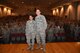 Col. Thomas K. Smith Jr., 433rd Airlift Wing commander, right, congratulates 1st Lt. Alyssa Kelly, of the 433rd Aeromedical Evacuation Squadron, after presenting her the Air Force Achievement Medal at commander’s call on April 3, 2016 during the 433rd AW commander's call April 3, 2016 at the Bob Hope Theater, Joint Base San Antonio-Lackland. (U.S. Air Force photo by Tech. Sgt. Carlos J. Trevino)