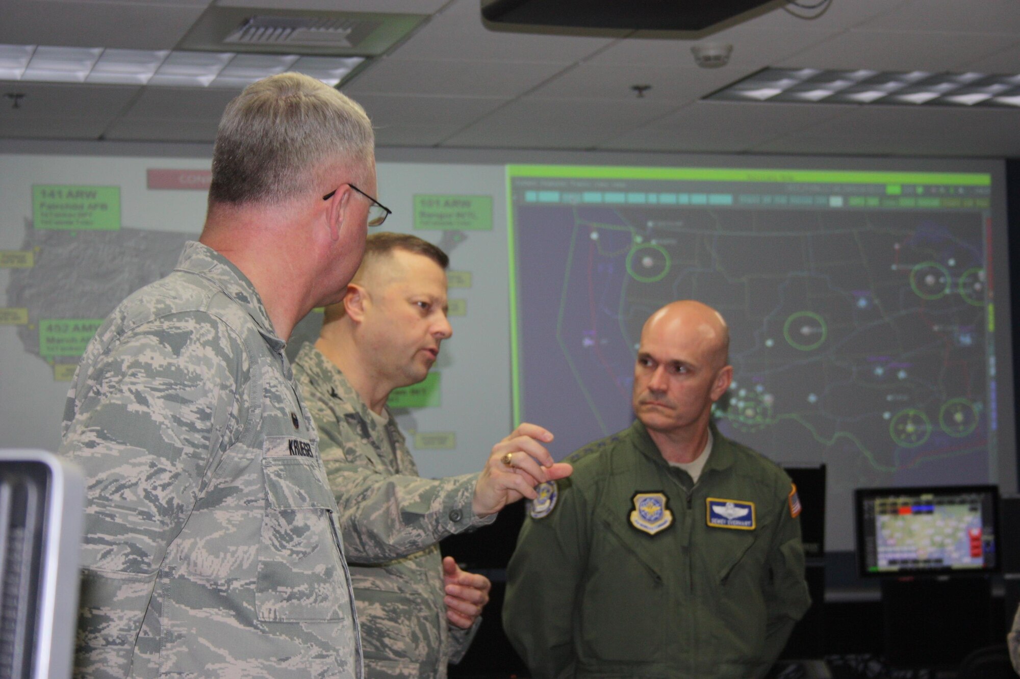 General Carlton D. Everhart II, right, Air Mobility Command commander, receives an update on the Western Air Defense Sector’s capabilities from Col. Gregor J. Leist, middle, WADS commander, during a tour of the unit’s operations floor April 6 at Joint Base Lewis-McChord.  WADS guards America’s skies 24/7 through the use of over 200 dedicated and shared radar devices.  WADS is responsible for maintaining North American Aerospace Defense Command (NORAD) air sovereignty and aerospace control over 73 percent of the western United States.