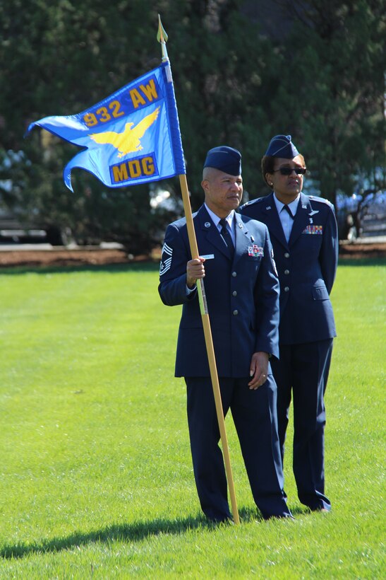 Leaders stand by for the next field movement in Illinois.  The 932nd Airlift Wing's Medical Group met out on the Scott Air Force Base parade field recently for a group photo and review of uniforms.  Watching the Airmen get into position are Chief Master Sgt. George Vaughn and the commander of the 932nd Medical Group, Col. Vanessa Mattox.  It took about an hour from start to finish to complete the rank and photography project, with a little help from the 932nd public affairs staff and the civil engineers.  (U.S. Air Force photo by Maj. Stan Paregien)