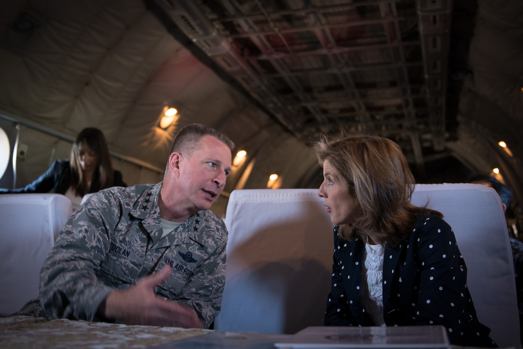 Lt. Gen. John Dolan, U.S. Forces, Japan and 5th Air Force commander, talks to Caroline Kennedy, U.S. Ambassador to Japan, while flying on a Japanese Air Self-Defense Force C-1 heading to Kumamoto City, Japan, April 29, 2016. Dolan and Kennedy visited Kumamoto Prefecture to get a first-hand look at the devastation caused by the recent earthquakes that hit the region and to show their support of the U.S.-Japan partnership. (U.S. Air Force photo by Staff Sgt. Michael Smith/Released)