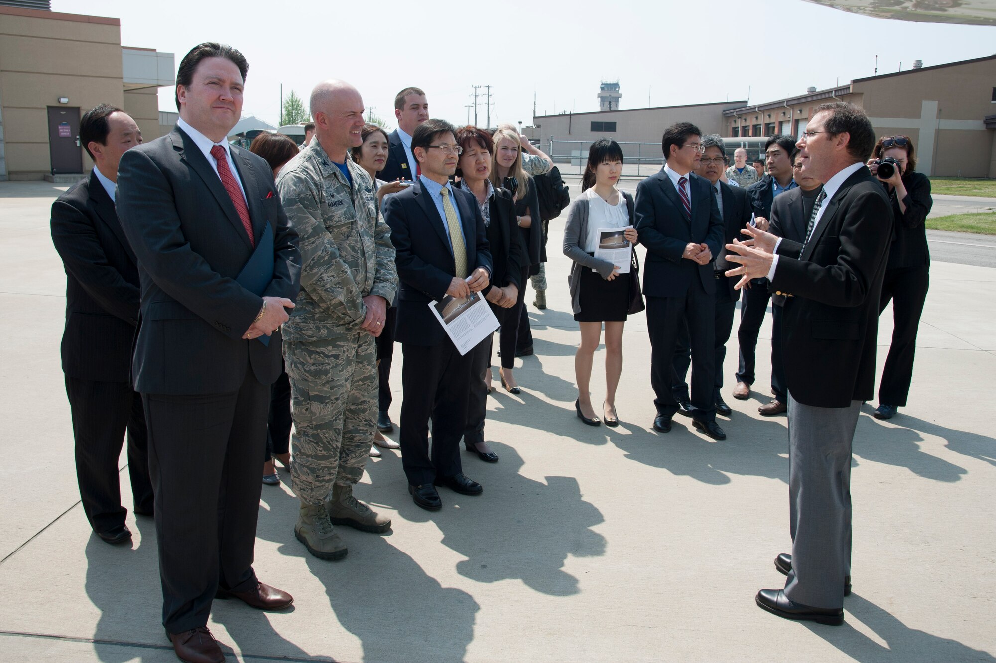 James Crawford, NASA lead U.S. scientist for Korea United States-Air Quality (KORUS-AQ) Experiment, gives an overview of the aircraft that will be participating in the KORUS-AQ to Marc Knapper, U.S. Embassy Seoul deputy chief of mission, and 51st Fighter Wing Commander, Col. Andrew Hansen, at Osan Air Base, Republic of Korea, April 29, 2016. KORUS-AQ is a joint field study by NASA and the National Institute of Environmental Research that will advance the ability to monitor air pollution more accurately from space. (U.S. Air Force photo by Staff Sgt. Jonathan Steffen/Released
