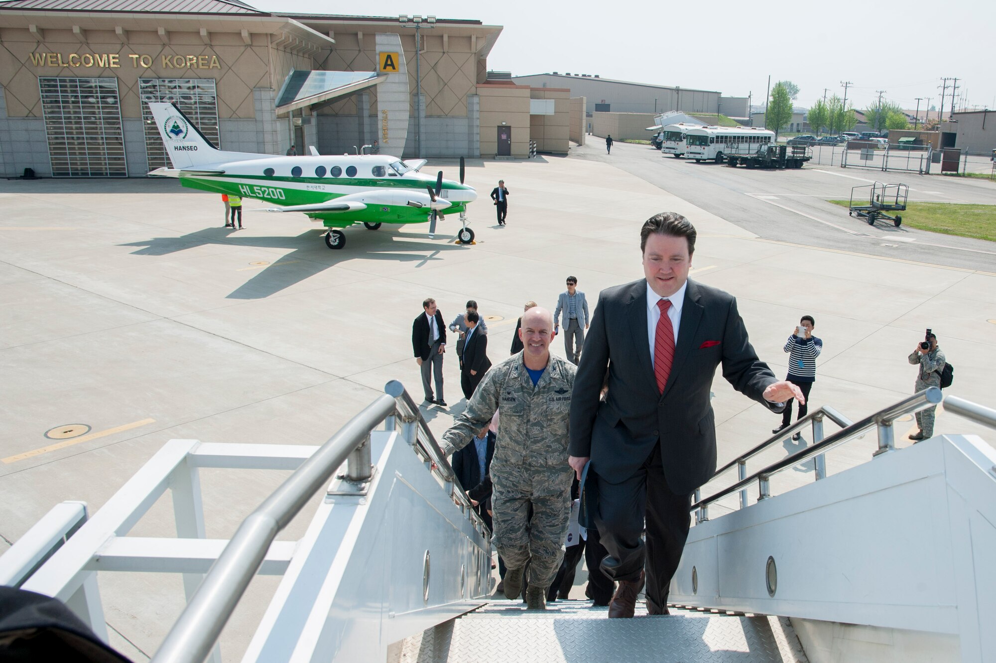 Marc Knapper, U.S. Embassy Seoul deputy chief of mission, and Col. Andrew Hansen, 51st Fighter Wing commander, step on board the NASA DC-8 that is part of the Korea United States-Air Quality (KORUS-AQ) Experiment at Osan Air Base, Republic of Korea, April 29, 2016. KORUS-AQ is a step toward an international effort to develop a global air quality observation system that will include satellites from both countries and a network of surface monitoring sites, models, and airborne sampling.(U.S. Air Force photo by Staff Sgt. Jonathan Steffen/Released)