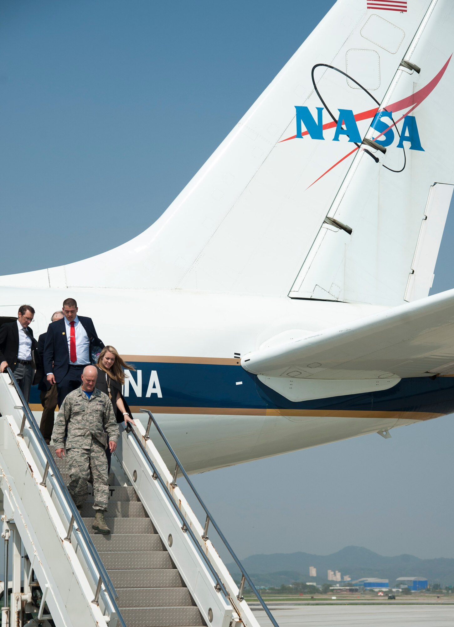 Col. Andrew Hansen, 51st Fighter Wing commander, walks off the NASA DC-8 that is part of the Korea United States-Air Quality (KORUS-AQ) Experiment at Osan Air Base, Republic of Korea, April 29, 2016. KORUS-AQ will collect air quality data over the Republic of Korea using aircraft, ground sites, and ships from May 2 until June 12. The U.S. and South Korean aircraft will conduct coordinated flights from Osan Air Base. (U.S. Air Force photo by Staff Sgt. Jonathan Steffen/Released)