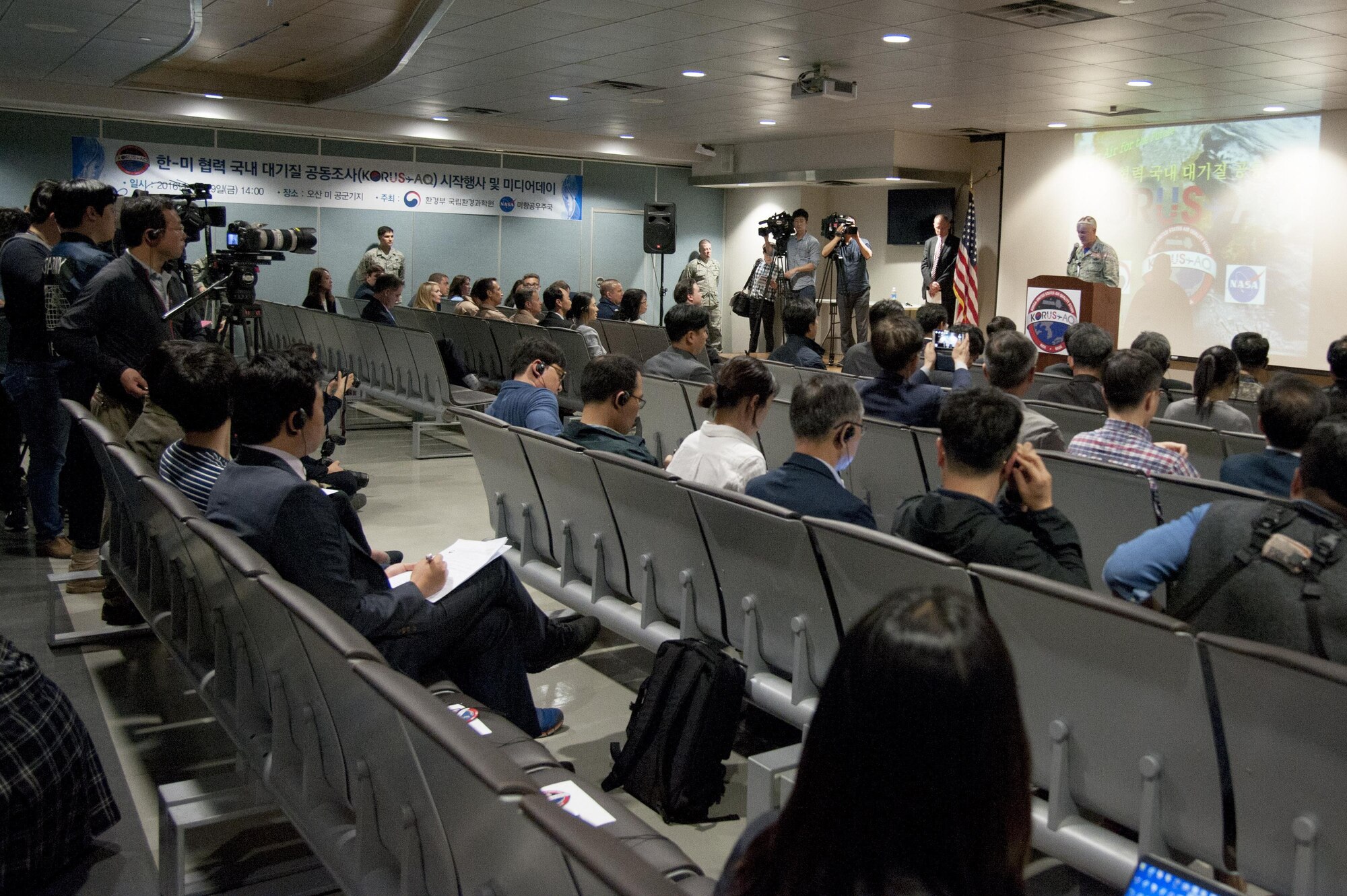 Col. Andrew Hansen, 51st Fighter Wing commander, gives opening remarks to the media during the Korea United States-Air Quality (KORUS-AQ) Experiment media day at Osan Air Base, Republic of Korea, April 29, 2016. KORUS-AQ will collect air quality data over the Republic of Korea using aircraft, ground sites and ships from May 2 until June 12. The U.S. and South Korean aircraft will conduct coordinated flights from Osan Air Base. (U.S. Air Force photo by Staff Sgt. Jonathan Steffen/Released)