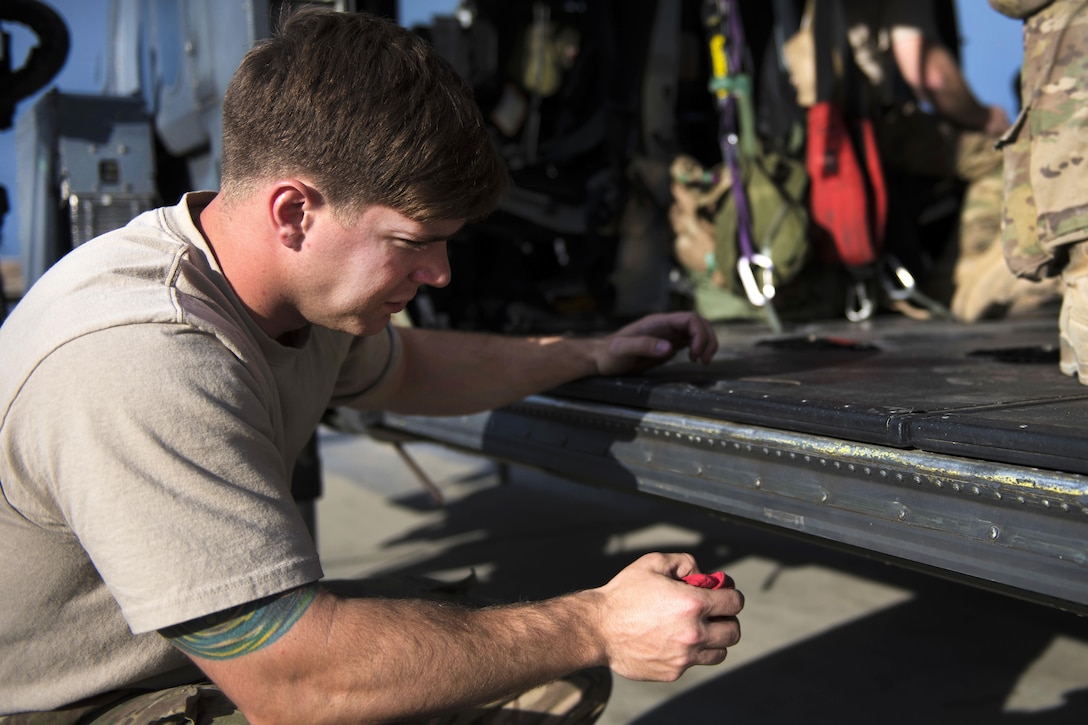Air Force Senior Airman Thomas Crawford conducts a preflight inspection on an HH-60G Pave Hawk at Bagram Airfield, Afghanistan, April 25, 2016. Crawford is a crew chief assigned to the 455th Expeditionary Aircraft Maintenance Squadron. Air Force photo by Senior Airman Justyn M. Freeman