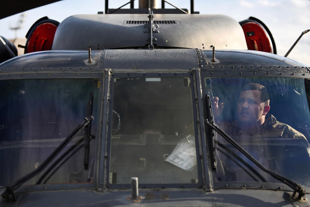 Air Force Staff Sgt. Ryan Wilkerson conducts a preflight inspection inside an HH-60G Pave Hawk at Bagram Airfield, Afghanistan, April 25, 2016. Wilkerson is a guidance and control journeyman assigned to the 455th Expeditionary Aircraft Maintenance Squadron. Air Force photo by Senior Airman Justyn M. Freeman