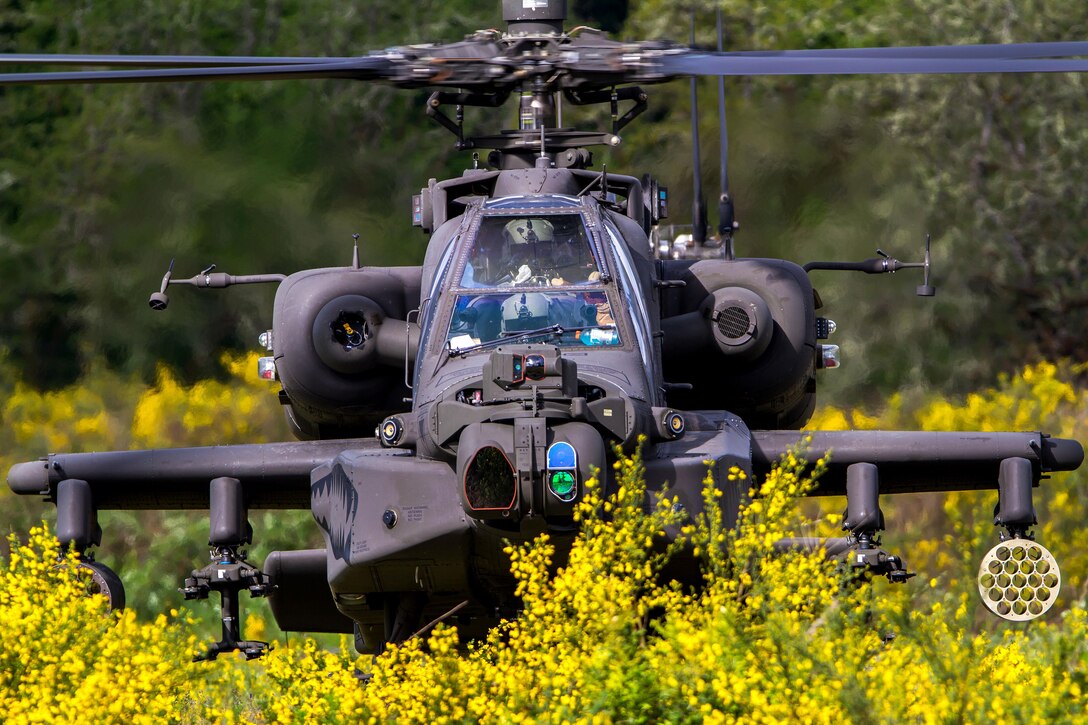 An AH-64 Apache helicopter hovers low while supporting soldiers conducting air assault training at Joint Base Lewis-McChord, Wash., April 27, 2016. Army photo by Capt. Brian Harris