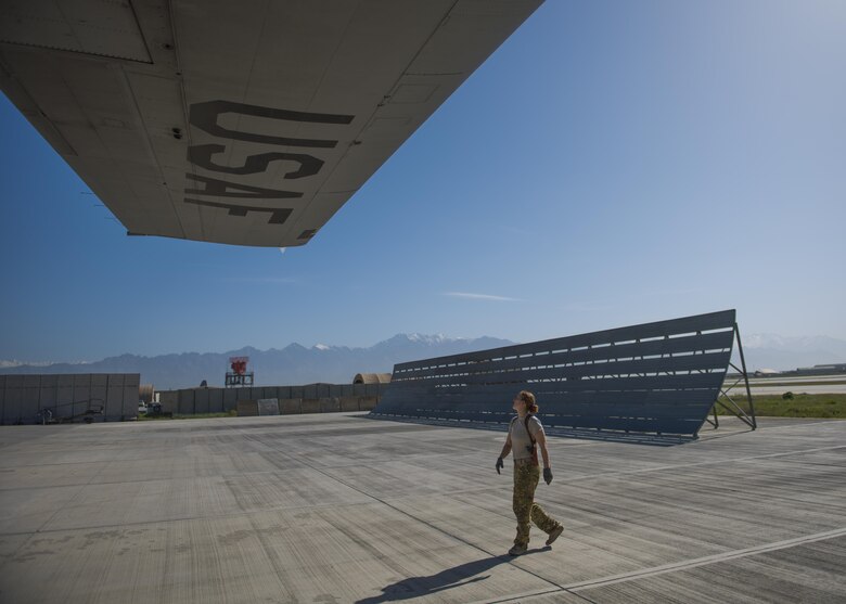 Senior Airman Jessica Jones, 774th Expeditionary Airlift Squadron loadmaster, conducts a pre-flight wing inspection of a C-130J Super Hercules at Bagram Airfield, Afghanistan, April 29, 2016. Aircraft loadmasters are responsible for properly loading, securing and escorting cargo and passengers, and ensuring the plane is properly balanced with the weight of the cargo evenly distributed. (U.S. Air Force photo by Senior Airman Justyn M. Freeman)