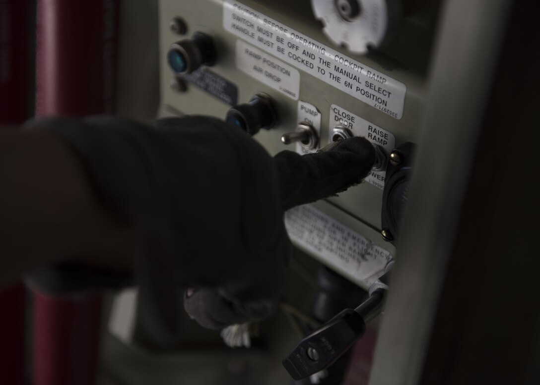 Senior Airman Jessica Jones, 774th Expeditionary Airlift Squadron loadmaster, lowers the ramp of a C-130J Super Hercules to accept cargo at Bagram Airfield, Afghanistan, April 29, 2016. Aircraft loadmasters are responsible for properly loading, securing and escorting cargo and passengers, and ensuring the plane is properly balanced with the weight of the cargo evenly distributed. (U.S. Air Force photo by Senior Airman Justyn M. Freeman)