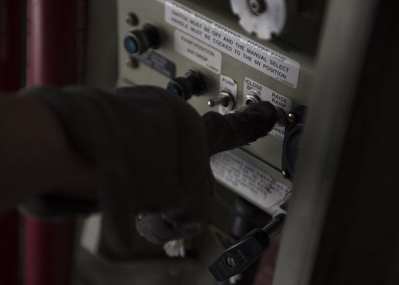Senior Airman Jessica Jones, 774th Expeditionary Airlift Squadron loadmaster, lowers the ramp of a C-130J Super Hercules to accept cargo at Bagram Airfield, Afghanistan, April 29, 2016. Aircraft loadmasters are responsible for properly loading, securing and escorting cargo and passengers, and ensuring the plane is properly balanced with the weight of the cargo evenly distributed. (U.S. Air Force photo by Senior Airman Justyn M. Freeman)