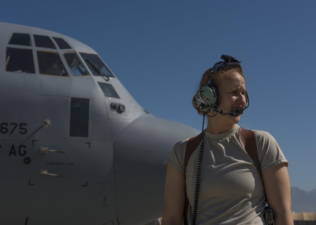 Senior Airman Jessica Jones, 774th Expeditionary Airlift Squadron loadmaster, looks over the flight line before the start up of the C-130J Super Hercules engines  at Bagram Airfield, Afghanistan, April 29, 2016. Members of the 774th EAS deliver cargo throughout Afghanistan in support of Operation Freedom's Sentinel and NATO's Resolute Support Mission. (U.S. Air Force photo by Senior Airman Justyn M. Freeman)