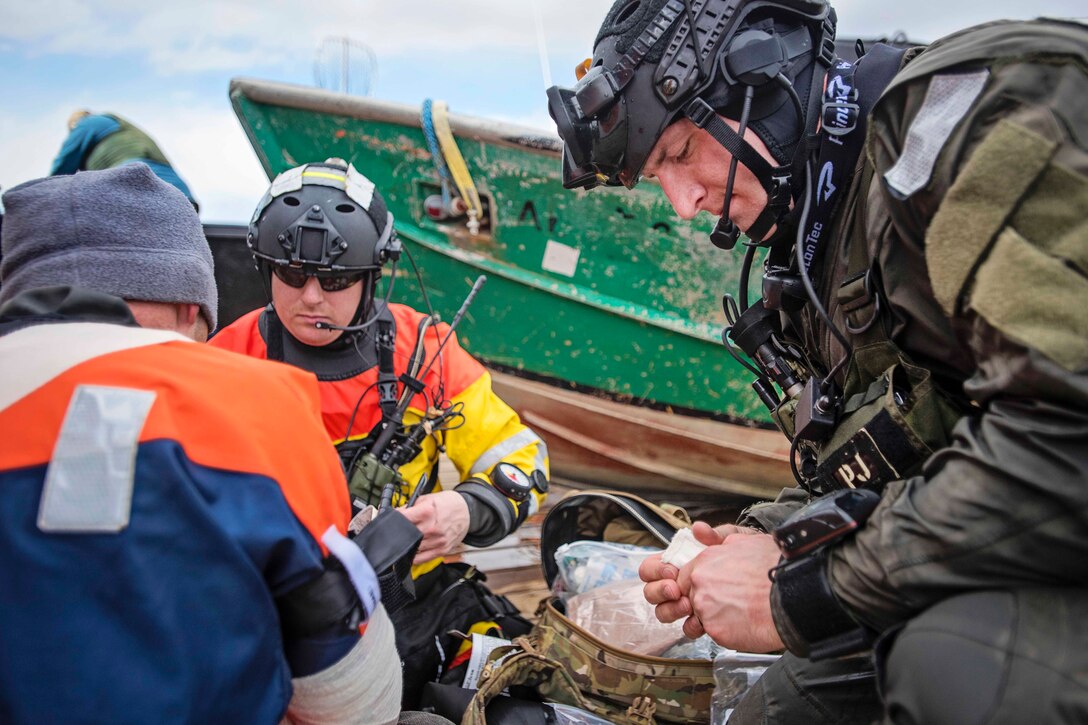 Airmen participate in a simulated casualty evacuation training exercise off the coast of Homer, Alaska, April 27, 2016. Alaska National Guard photo by Air Force Staff Sgt. Edward Eagerton 