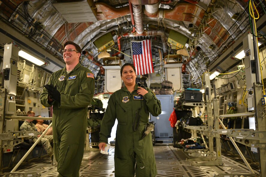 Master Sgts. Kiley and Jennifer Gerritsen, aeromedical technicians with the 445th Aeromedical Evacuation Squadron, Wright-Patterson Air Force Base, Ohio, help provide care for wounded warriors while deployed here April 21, 2016. During their deployment, the husband and wife team serve on separate crews tasked to rotate moving medical patients from down range to Germany and/or back to the United States. Even though they are on separate crews, their paths often cross as crews help others with preparing the aircraft and loading patients before going off on missions. (U.S. Air Force photo/Tech. Sgt. Frank Oliver)