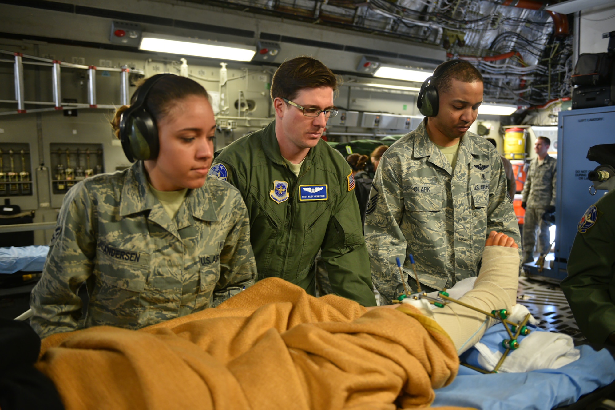 Master Sgt. Kiley Gerritsen, an aeromedical technician with the 445th Aeromedical Evacuation Squadron, Wright-Patterson Air Force Base, Ohio, helps provide care for wounded warriors while deployed here April 21, 2016. Kiley and his wife, Jennifer, also assigned to the 445th AES, had the opportunity to serve together on this flight as they usually serve on separate crews tasked to rotate moving medical patients from down range to Germany and/or back to the United States. Even though they are on separate crews, their paths often cross as crews help others with preparing the aircraft and loading patients before going off on missions. (U.S. Air Force photo/Tech. Sgt. Frank Oliver)
