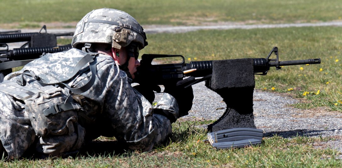 Army Staff Sgt. Garrett Cummings fires an M16 rifle from the prone supported position during the weapons qualification event of the Best Warrior Competition at Camp Smith Training Site near Peekskill, N.Y., April 21, 2016. Cummings is a military police officer assigned to the New York Army National Guard’s 106th Regional Training Institute. Competing soldiers are tested on their physical fitness, military knowledge, endurance, marksmanship and land navigation skills. New York National Guard photo by Army Sgt. Michael Davis
