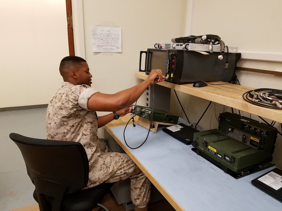 Lance Corporal George E. Watford Jr.is testing an RT-1694 Harris radio with one of the Marine Corps newest pieces of test equipment.  This prepares Ground Radio Repair Marines to employ and troubleshoot ground radio communication equipment for the Operational Marine Forces.  Lance Corporal Watford is currently a student in the Ground Radio Repair Course and has maintained a 93% grade point average.