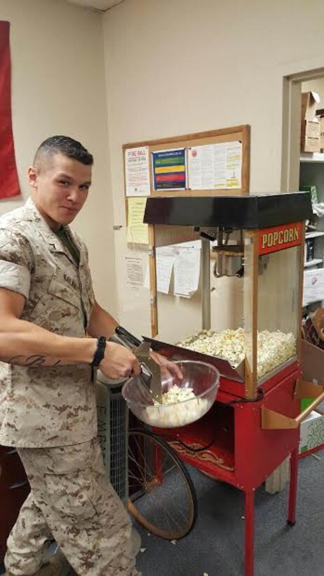 PFC E. Balan is learning how to make popcorn for the upcoming Family Day event that will be taking place on 5May at the base Golf Course.