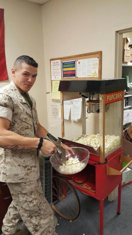 PFC E. Balan is learning how to make popcorn for the upcoming Family Day event that will be taking place on 5May at the base Golf Course.