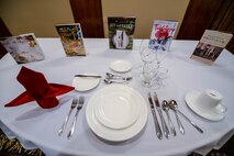 A table and literature stand displayed at the “Dining like a Diplomat” course hosted at the Patriot Club on Offutt Air Force Base, Nebraska, April 20, 2016. The course is an etiquette training course offered to Team Offutt to teach proper protocol and skills for social and business situations. 
