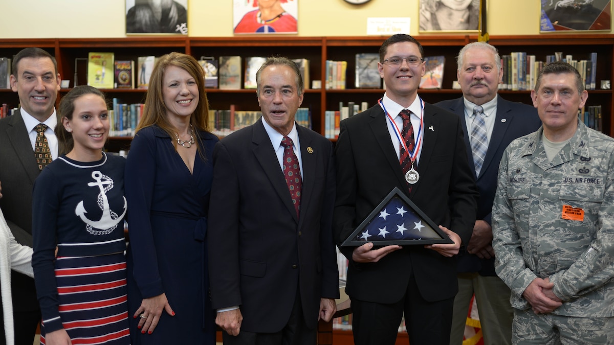 Gabriel Curcione poses with family and members of the community, Friday, April 22, 2016, after receiving the Congressional Silver Medal at Wilson High School in Wilson, New York. Curcione received the award after performing more than 400 hundred hours of volunteerism, community service, and personal development. (U.S. Air Force photo by Staff Sgt. Richard Mekkri)