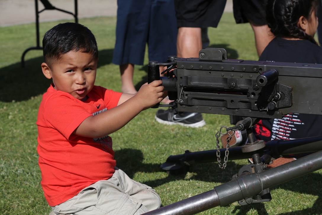 MARINE CORPS BASE CAMP PENDLETON, Calif. – A young boy plays with a M2 .50 caliber heavy machine gun during the 3rd Battalion, 5th Marine Regiment “Dark Horse” Reunion at the San Mateo Memorial Garden April 29, 2016. The reunion included a barbecue and a hike up First Sergeant’s Hill to honor the fallen Marines of 3/5 who were deployed to Sangin, Afghanistan in the fall of 2010. (U.S. Marine Corps photo by Lance Cpl. Shellie Hall/Released)