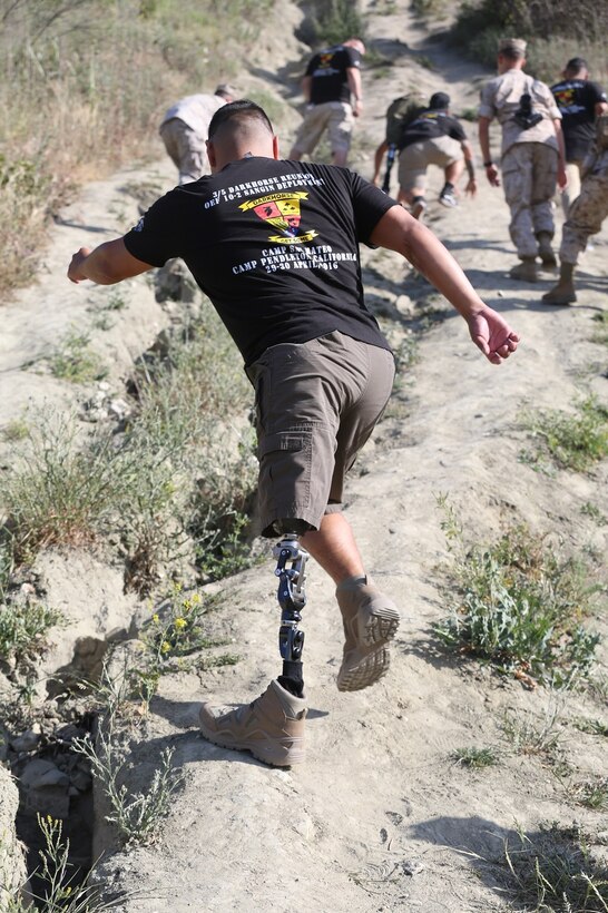 MARINE CORPS BASE CAMP PENDLETON, Calif. – Sgt. Marcus Chischilly makes his way up the side First Sergeant’s Hill to honor his fallen comrades during the 3rd Battalion, 5th Marine Regiment “Dark Horse” Reunion at the San Mateo Memorial Garden April 29, 2016. Chischilly served as a rifleman with Company K during the battalion’s deployment to Sangin, Afghanistan in the fall of 2010. (U.S. Marine Corps photo by Lance Cpl. Shellie Hall/Released)