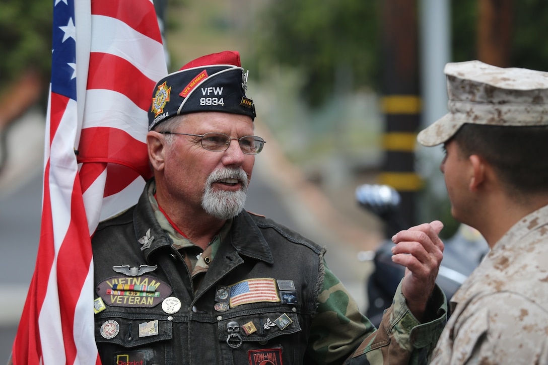 MARINE CORPS BASE CAMP PENDLETON, Calif. – Bob Pruitt speaks with a Marine before the start of the 3rd Battalion, 5th Marine Regiment “Dark Horse” Reunion at the San Mateo Memorial Garden April 29, 2016. Pruitt, a Vietnam War veteran and former Navy petty officer, is now a Patriot Guard Rider. (U.S. Marine Corps photo by Lance Cpl. Shellie Hall/Released)