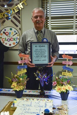 Daniel Lucci stands for a picture at his retirement party at the Pittsburgh International Air Reserve Station, Pennsylvania, March 29, 2016. Lucci began his 45 years of military service in the U.S. Navy in 1971, followed by 41 years with the 911th Airlift Wing. (U.S. Air Force photo by Airman Bethany Feenstra)