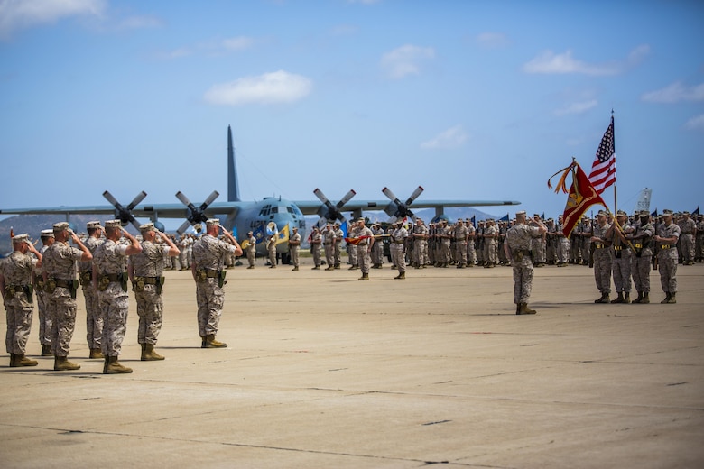 The 4th Marine Aircraft Wing color guard team march on the colors at a change of command ceremony at Marine Corps Air Station Miramar, California, April 29, 2016. Maj. Gen. William T. Collins relinquished command of 4th MAW to Brig. Gen. Bradley S. James, the previous assistant wing commander of 4th MAW. 