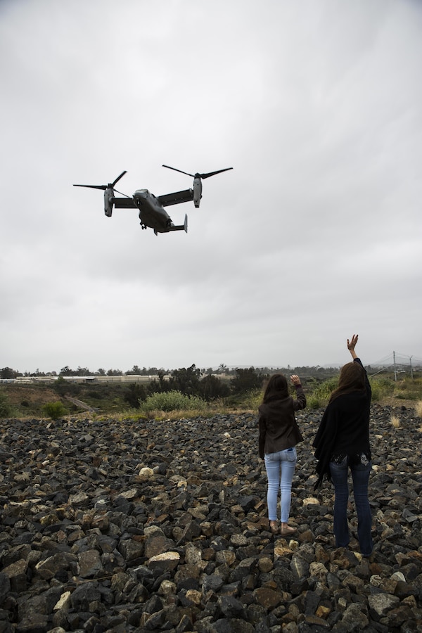 Maj. Gen. William T. Collins, commanding general of 4th Marine Aircraft Wing, Marine Forces Reserve, passes over his family in a MV-22 Osprey while he conducts his final flight with Marine Medium Helicopter Squadron 764 (HMM-764), Marine Aircraft Group 41, 4th MAW, before they officially reached full operational capability at Marine Corps Air Station Miramar, Calif., April 27, 2016. His final flight signified his trust and confidence within the Marines of HMM-764 as they reach their last major milestone to become completely combat ready and deployable. 