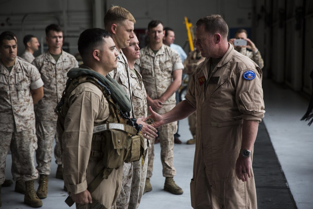 Maj. Gen. William T. Collins, commanding general of 4th Marine Aircraft Wing, Marine Forces Reserve, congratulates Marines with Marine Medium Helicopter Squadron 764 (HMM-764), Marine Aircraft Group 41, 4th MAW, after his final flight and officially reaching full operational capability at Marine Corps Air Station Miramar, Calif., April 27, 2016. His final flight signified his trust and confidence with the Marines of HMM-764 as they reach their last major milestone to become completely combat ready and deployable.