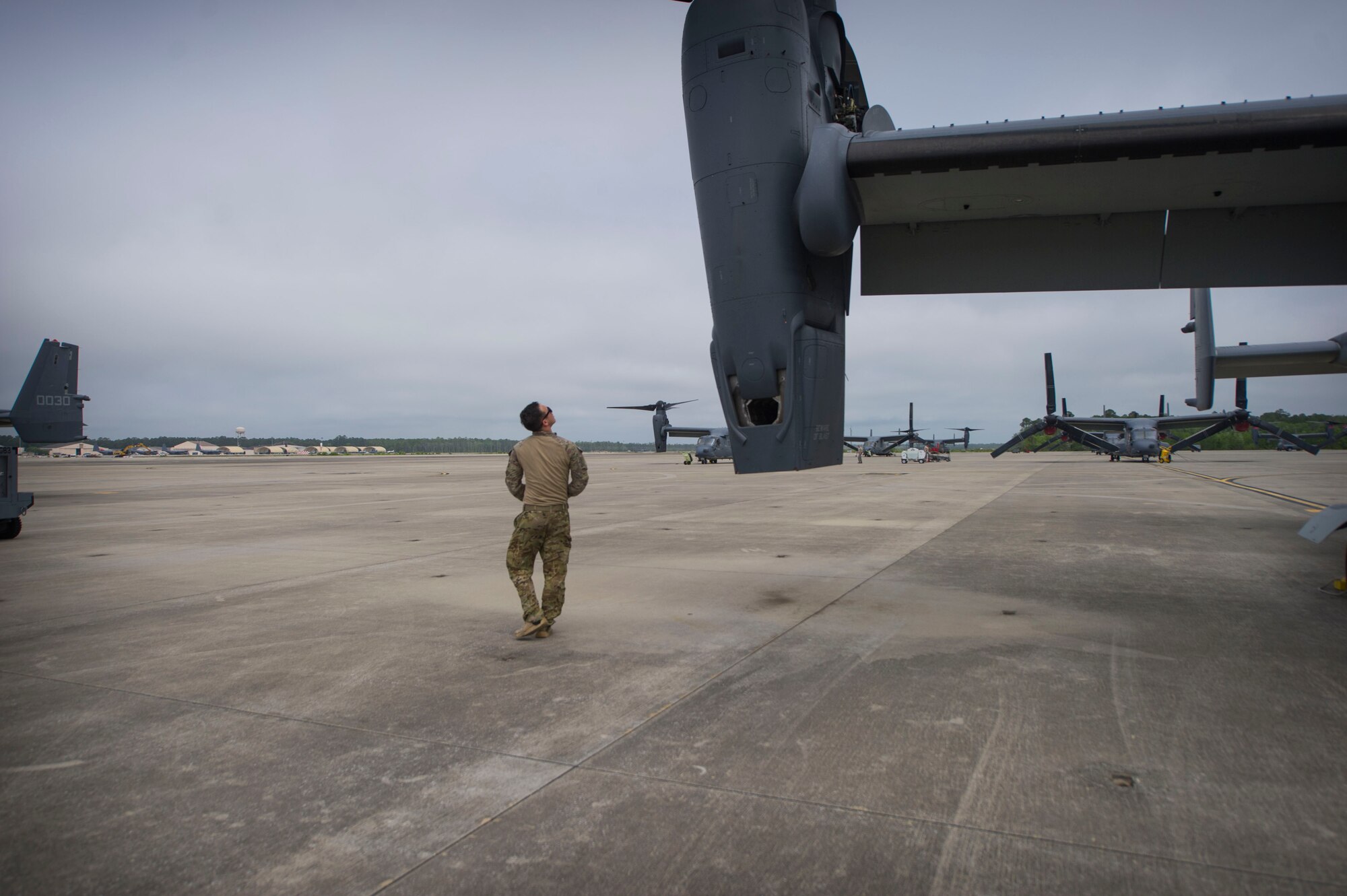 Staff Sgt. Samuel Levander, a flight engineer with the 8th Special Operations Squadron, performs a pre-flight inspection on a CV-22 Osprey at Hurlburt Field, Fla., April 27, 2016. The Osprey is a multi-mission tilt-rotor aircraft with vertical take-off and landing capability. (U.S. Air Force photo by Senior Airman Krystal M. Garrett)