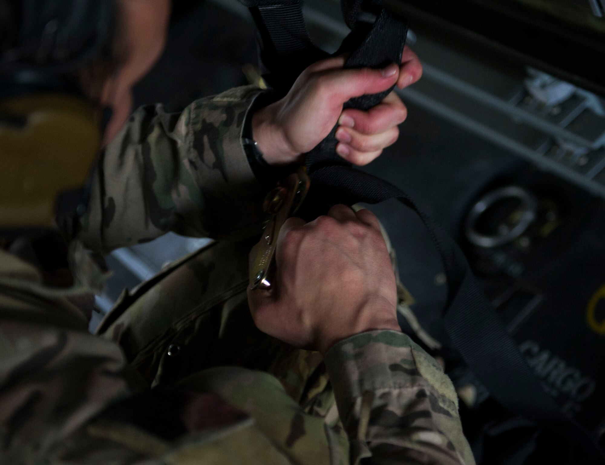Staff Sgt. Samuel Levander, a flight engineer with the 8th Special Operations Squadron, tightens down a strap on a CV-22 Osprey at Hurlburt Field, Fla., April 27, 2016. The 8th SOS is one of the oldest units in the United States Air Force, originally organized as the 8th Aero Squadron, June 21, 1917, at Kelly Field, Texas.  (U.S. Air Force photo by Senior Airman Krystal M. Garrett)
